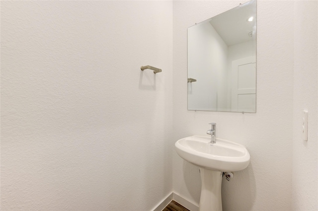 bathroom with baseboards