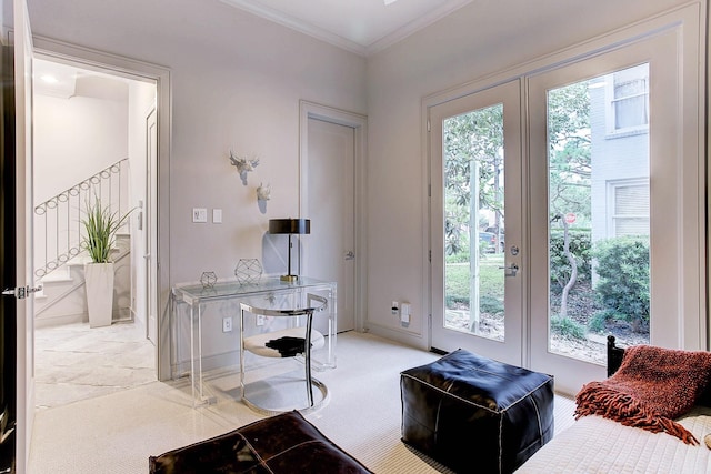 interior space with french doors, light carpet, crown molding, and baseboards