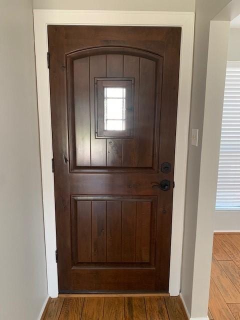 doorway with wood finished floors