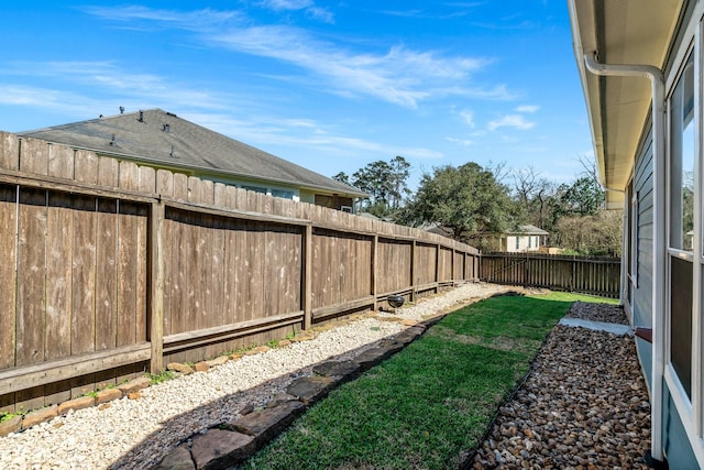 view of yard with a fenced backyard