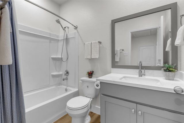 bathroom featuring toilet, shower / bath combination with curtain, wood finished floors, and vanity