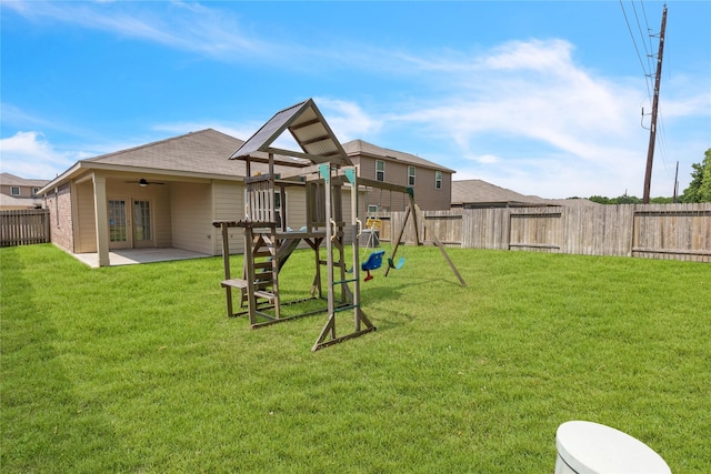 view of jungle gym featuring a fenced backyard, a ceiling fan, french doors, and a yard