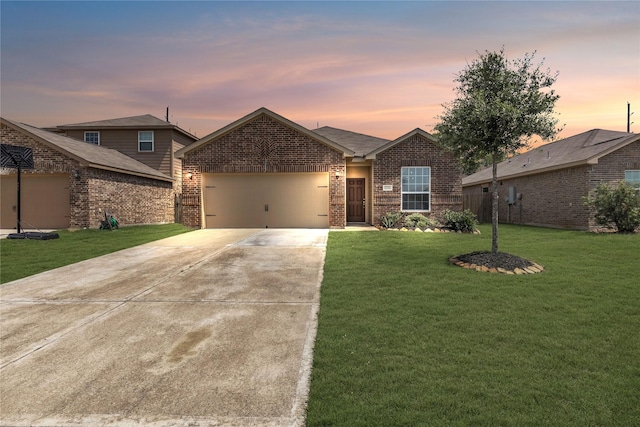 single story home featuring concrete driveway, brick siding, a lawn, and an attached garage