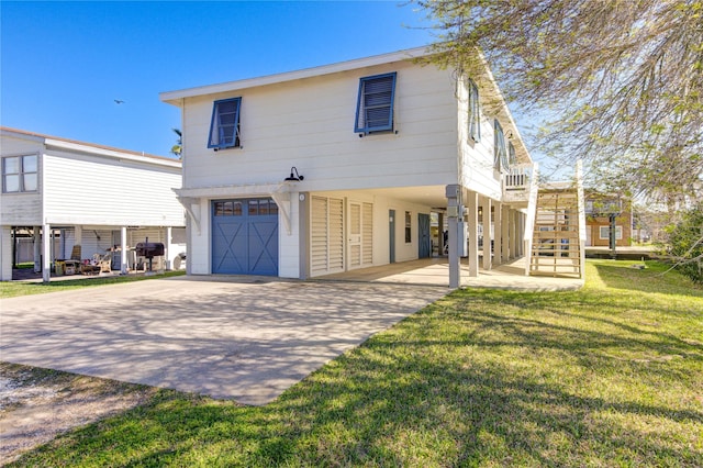 view of front of house with a garage, stairway, a front lawn, and concrete driveway