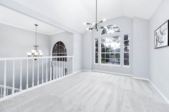 interior space featuring carpet, vaulted ceiling, baseboards, and an inviting chandelier