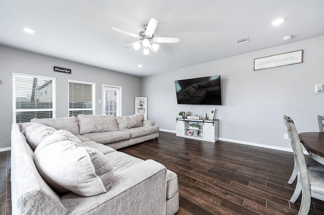 living room featuring baseboards, visible vents, recessed lighting, ceiling fan, and dark wood-type flooring