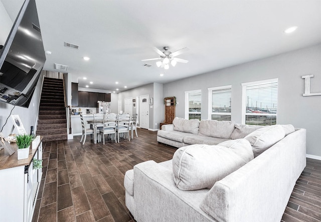 living area with visible vents, recessed lighting, stairs, and wood tiled floor