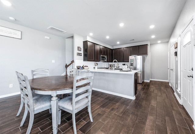 dining space featuring recessed lighting, visible vents, baseboards, and dark wood-style floors