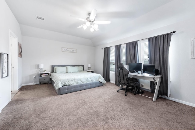 carpeted bedroom featuring visible vents, baseboards, a ceiling fan, and vaulted ceiling