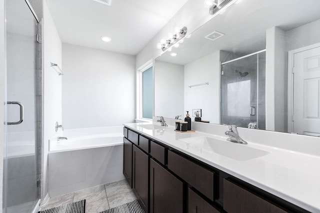 full bath with a garden tub, a stall shower, visible vents, and a sink