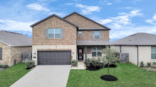 traditional-style house with an attached garage, brick siding, fence, concrete driveway, and a front lawn