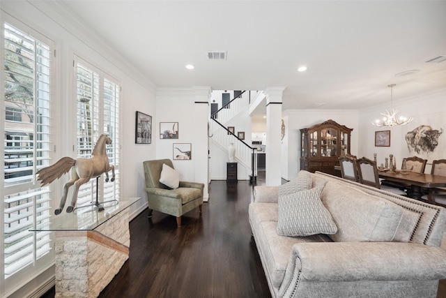 living area with dark wood-style flooring, stairs, visible vents, and ornamental molding