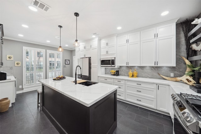 kitchen featuring stainless steel appliances, dark tile patterned floors, visible vents, and white cabinets