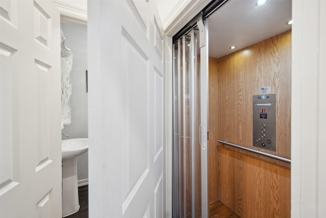 interior space featuring elevator and wood finished floors
