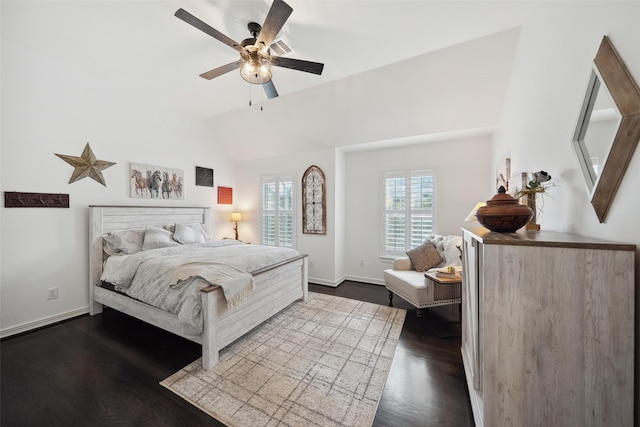 bedroom featuring lofted ceiling, baseboards, dark wood-style flooring, and ceiling fan