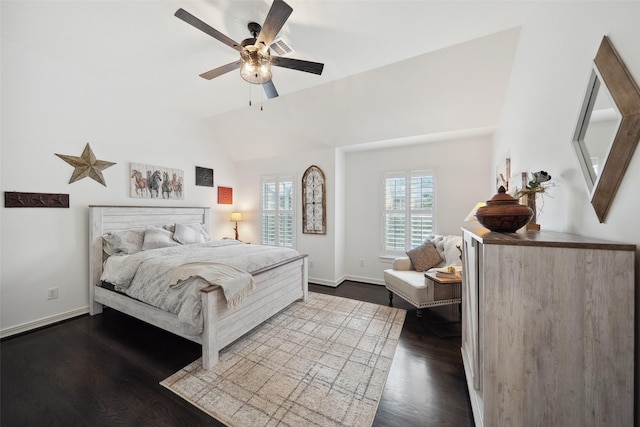 bedroom with ceiling fan, baseboards, dark wood-style floors, and vaulted ceiling