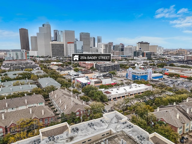 birds eye view of property featuring a view of city