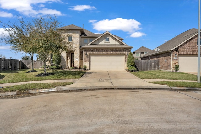 view of front facade featuring fence, concrete driveway, and a front yard