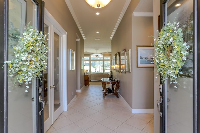 entryway with light tile patterned floors, recessed lighting, baseboards, french doors, and crown molding