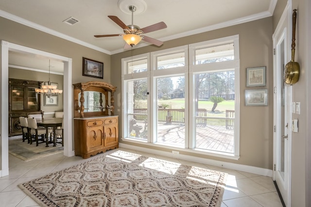 doorway with a wealth of natural light, ornamental molding, light tile patterned flooring, and visible vents