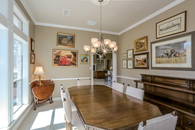 dining area featuring a healthy amount of sunlight, visible vents, ornamental molding, and a notable chandelier