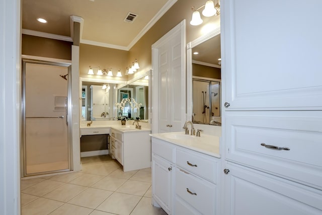 full bath with visible vents, ornamental molding, a sink, a shower stall, and tile patterned floors