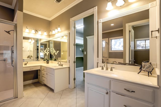 bathroom with ornamental molding, tile patterned flooring, two vanities, and a sink