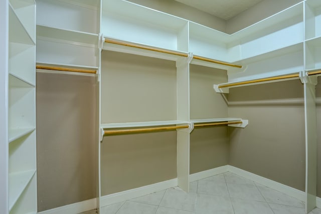 spacious closet with tile patterned flooring