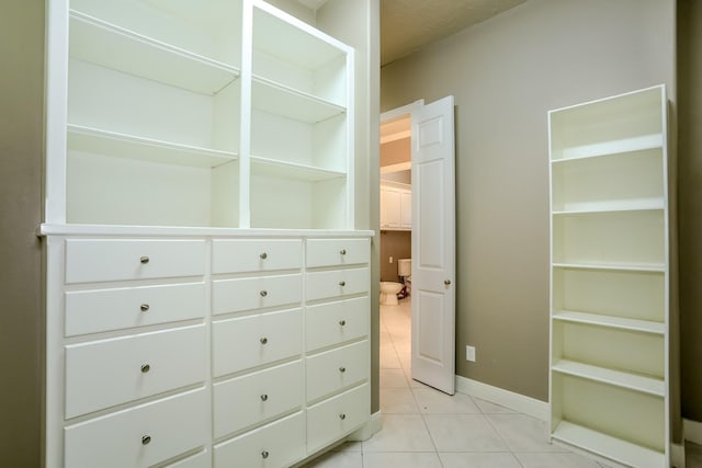 walk in closet featuring light tile patterned floors