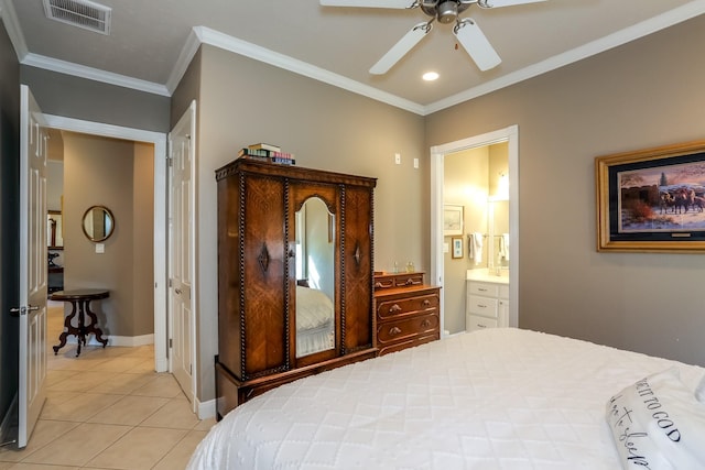 bedroom with baseboards, visible vents, ensuite bathroom, crown molding, and light tile patterned flooring