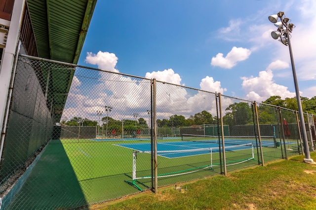 view of sport court with fence