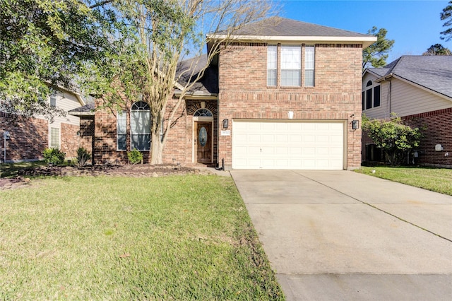 view of front of home with an attached garage, brick siding, driveway, and a front lawn