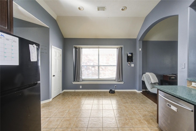 kitchen with visible vents, arched walkways, lofted ceiling, freestanding refrigerator, and stainless steel dishwasher