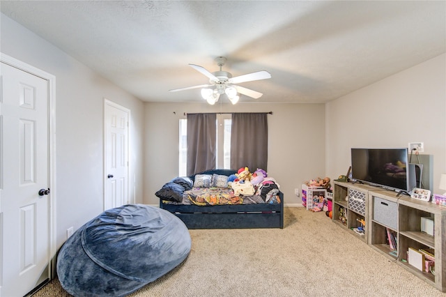 bedroom with ceiling fan and carpet flooring