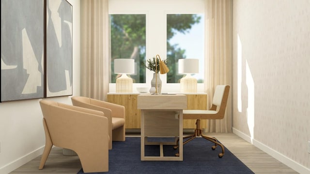 dining room featuring baseboards and wood finished floors