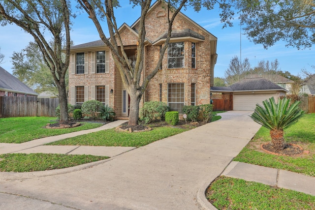 view of front of property with brick siding, a front yard, and fence