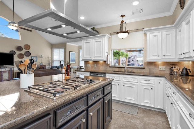 kitchen featuring a sink, white cabinetry, visible vents, island exhaust hood, and stainless steel gas stovetop