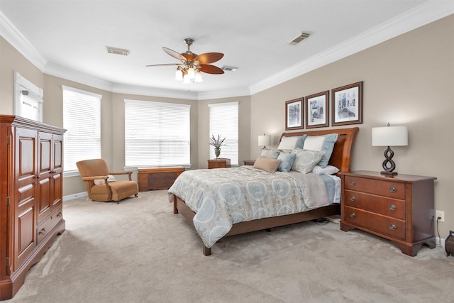 bedroom featuring ornamental molding, light colored carpet, and visible vents