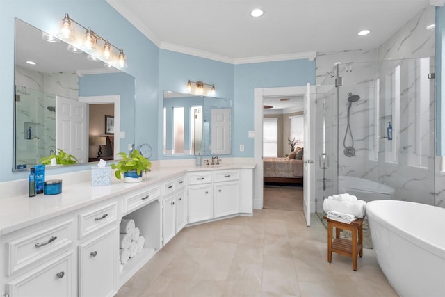 ensuite bathroom with a marble finish shower, a soaking tub, ensuite bath, ornamental molding, and vanity