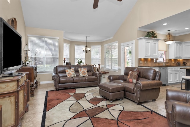 living area with crown molding, baseboards, and light tile patterned floors