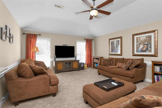 living room with baseboards, visible vents, a ceiling fan, light colored carpet, and lofted ceiling