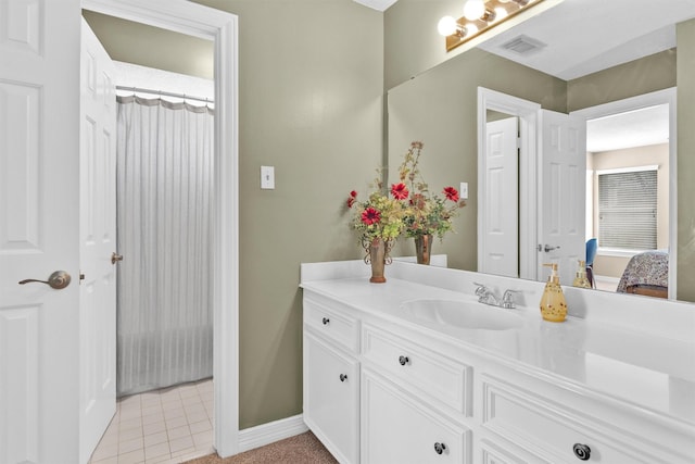 full bathroom with baseboards, visible vents, tile patterned floors, ensuite bathroom, and vanity