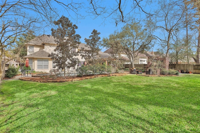 view of yard with fence