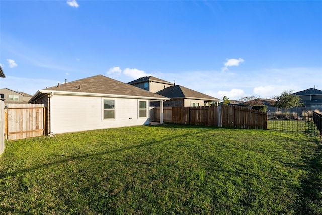 14428 Sugar Pines Dr, Conroe, TX 77302 - rear view of property with a fenced backyard and a yard