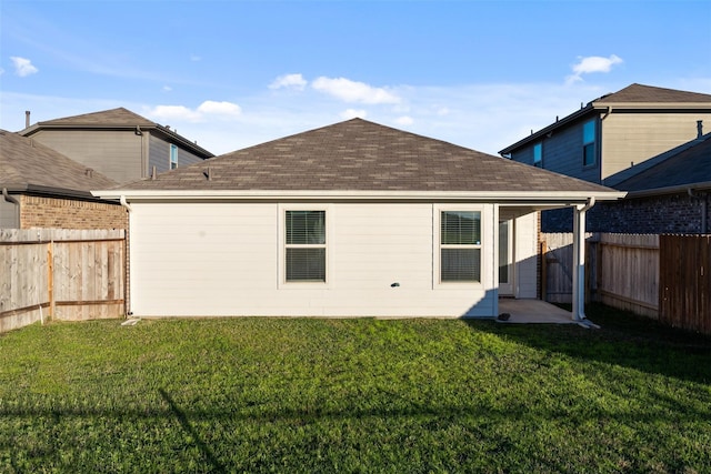 14428 Sugar Pines Dr, Conroe, TX 77302 - rear view of property with a yard, a shingled roof, and a fenced backyard