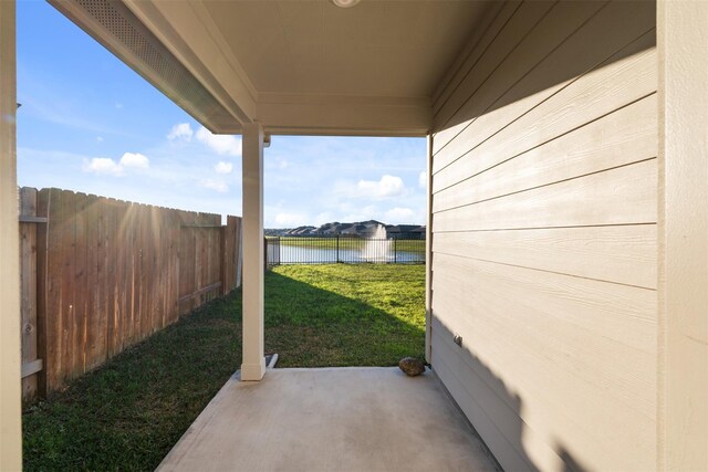 14428 Sugar Pines Dr, Conroe, TX 77302 - view of yard with fence, a water view, and a patio area