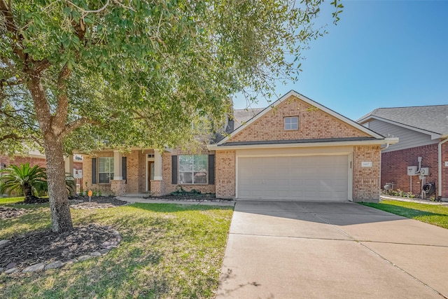 view of front of property featuring a garage, a front lawn, concrete driveway, and brick siding