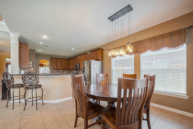 dining area featuring light tile patterned floors, baseboards, and recessed lighting