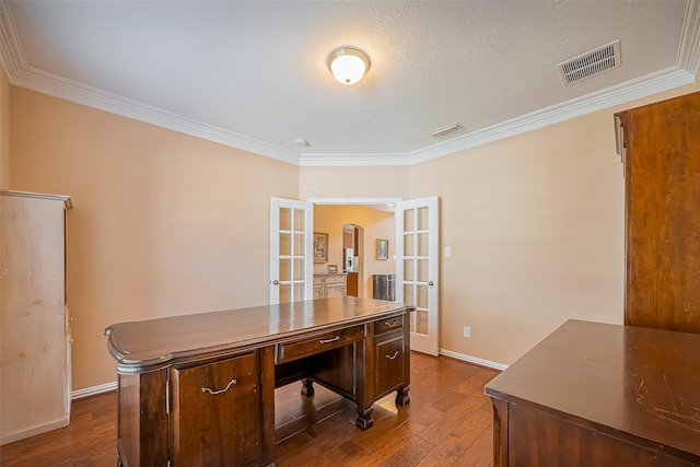 office featuring crown molding, visible vents, dark wood-style flooring, and french doors