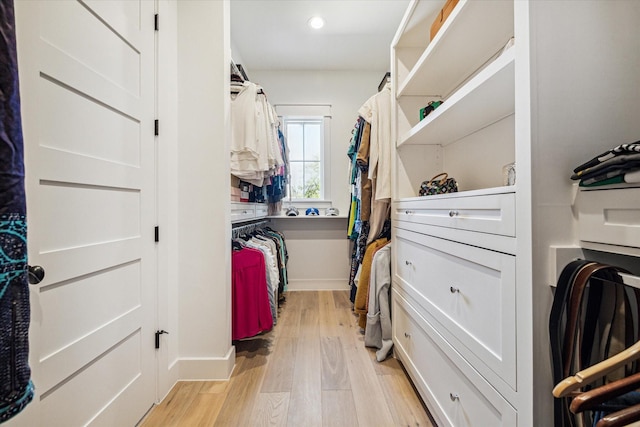 walk in closet featuring light wood-style floors